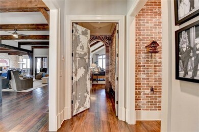 Antique doors lead you to the main level master su