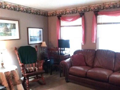 Large windows let in the sun into the living room.