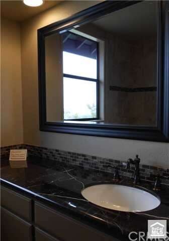 Secondary bath with new granite, fixtures and mirr