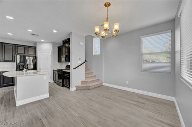 Kitchen featuring range with gas cooktop, refriger