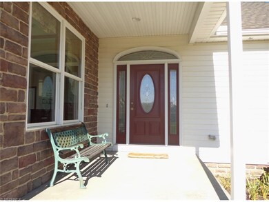 This covered front porch has an awesome lake view