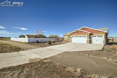 View of side of property with a garage