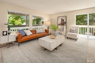 Another angle of the formal living room shows the beauty of the greenbelt that surrounds the home.