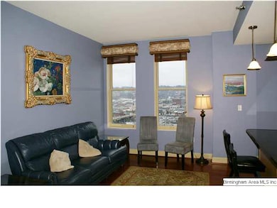 Living Room features hardwoods and large windows w