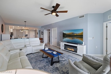 Living room featuring ceiling fan