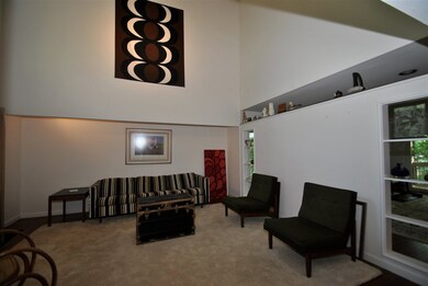 This unique room has a vaulted ceiling and built i