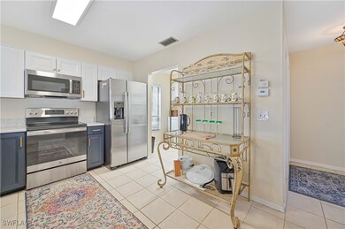 Kitchen with white cabinetry, stainless steel appl