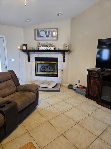 Living room with a tiled fireplace, tile patterned