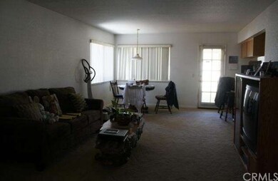 Family room with door exiting to back patio. Kitch