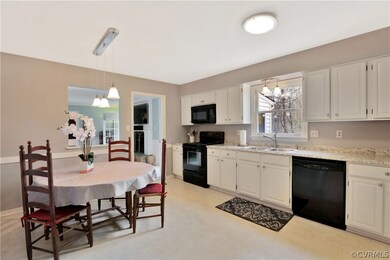 Kitchen opens to Family Room. New light fixtures.