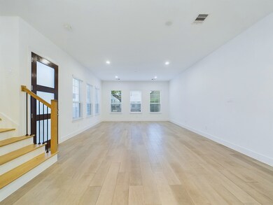 Corner view of the 1st floor dining, living, and t
