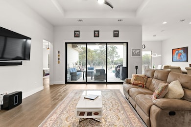 Light filled living with 3-panel slider to the covered patio.