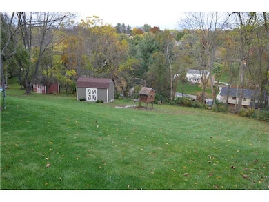 Exterior Back. Large back yard with storage shed a