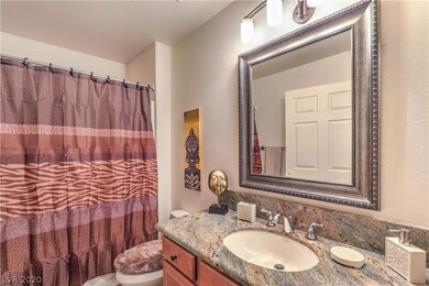 SECONDARY BATH HAS GRANITE COUNTER TOP AND TILE FL