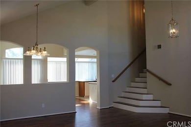 Partial view of the kitchen, dining room and stair