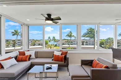 Sunroom featuring ceiling fan