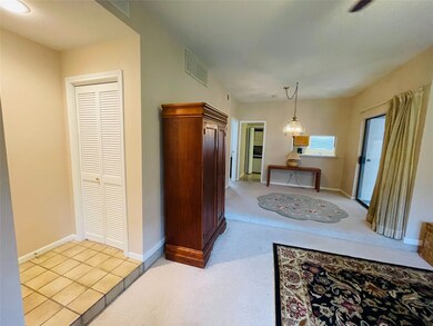 living room looking to dining area and kitchen