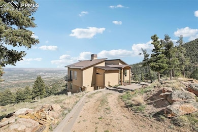 Side of the home with a paved circular driveway