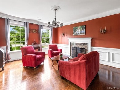 Living Room with brick fireplace, wall sconces, su