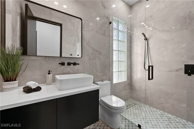 Bathroom featuring tile walls, backsplash, walk in