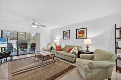 Living area with light tile patterned flooring and ceiling fan