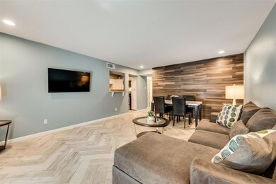 Living room featuring light parquet flooring