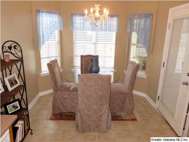 The eat-in kitchen is loaded with natural light an