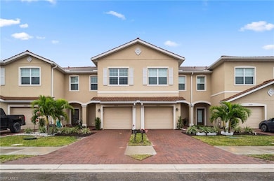 Multi unit property featuring driveway, stucco sid