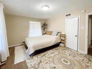 Upstairs main bedroom with tenant's furniture.