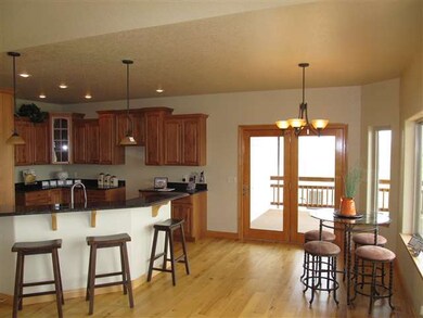 Breakfast nook just off of the kitchen with a priv