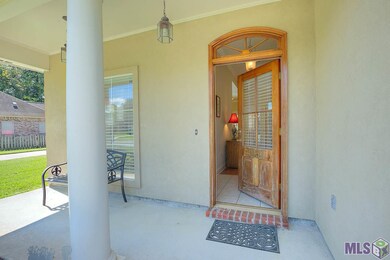 Welcoming front porch viewing the flower beds.