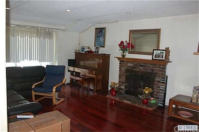 BRICK FIREPLACE IN LIVING ROOM
