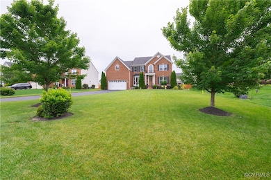 Front yard and brick siding