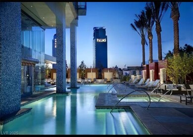 Pool featuring a patio and a hot tub