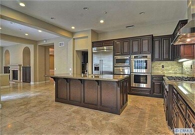 Gourmet kitchen with double oven, warming drawer &