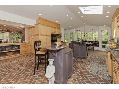 Two large islands define the kitchen which opens t