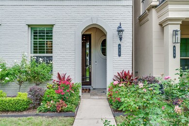 Elegant entryway with a light brick exterior and a