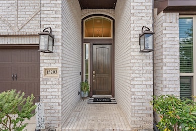 Welcoming covered front porch, solid wood entry do