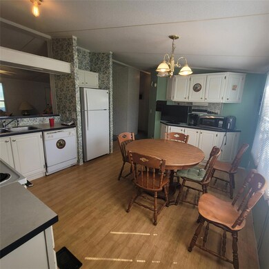 Dining room featuring light wood-style floors, va
