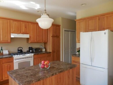 The spacious kitchen features plenty of cabinets a