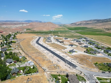 Aerial view of property's location featuring mountains