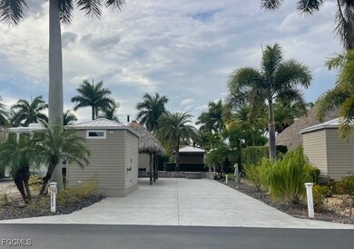 View of side of home with concrete driveway