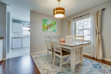 Dining area has plenty of natural light and wood f