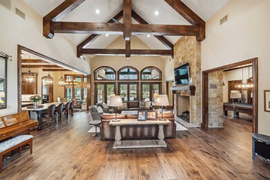 Upon entry, rich walnut hardwood flooring creates