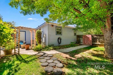 Back of house with a patio and a gate