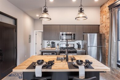 Kitchen featuring stainless steel appliances, hang