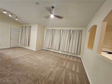 Unfurnished room with a ceiling fan, carpet floors