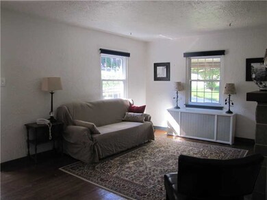 Living Room. The living room features hardwood flo