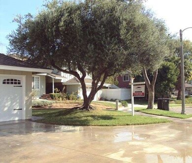 This gorgeous home is located on a lovely tree-lin
