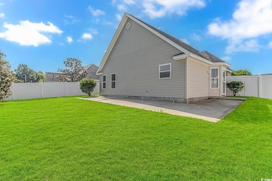 Back of property with a patio